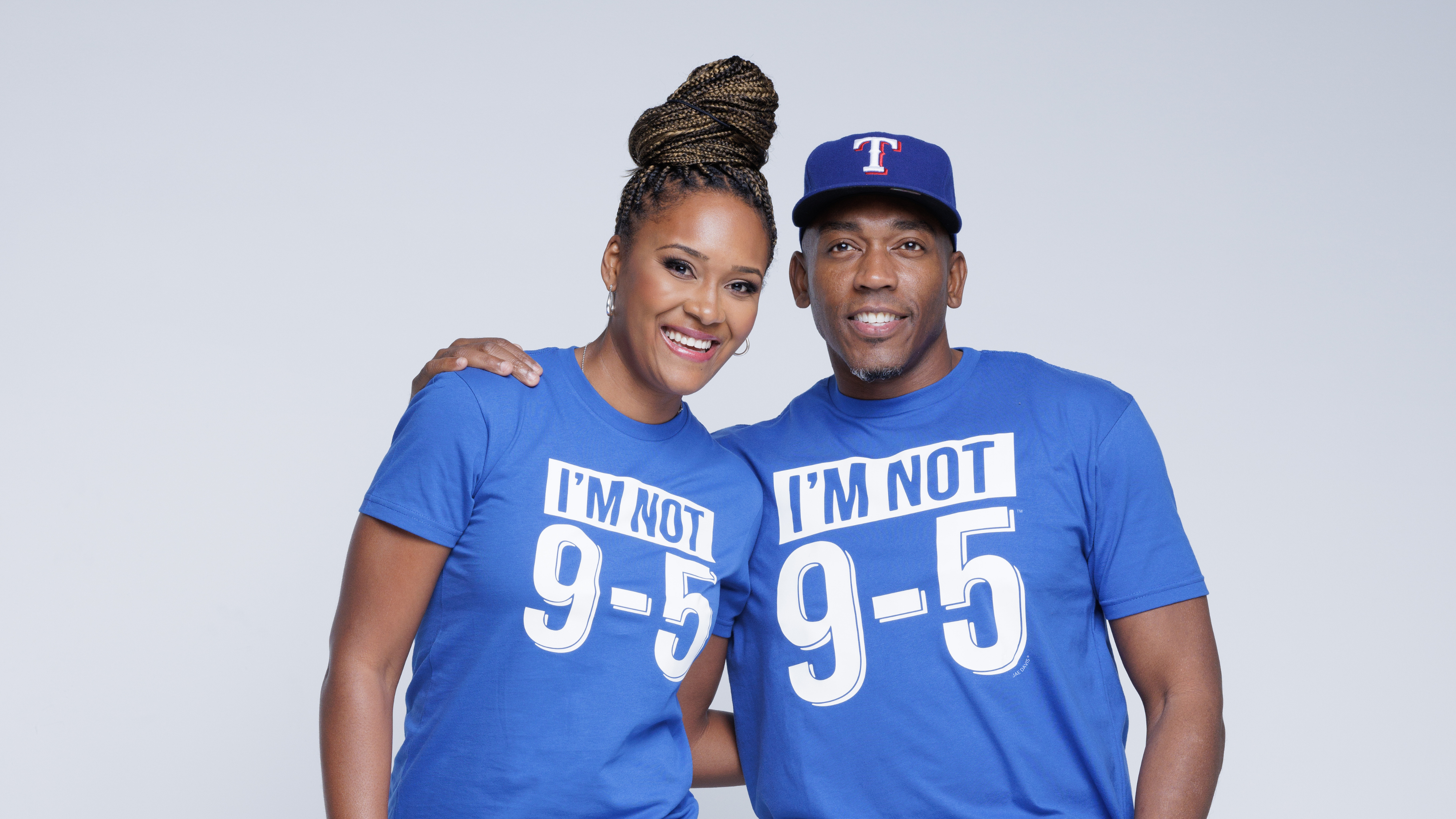 Two people wearing blue shirts with &#39;I&#39;m Not 9-5&#39; text on a gray background