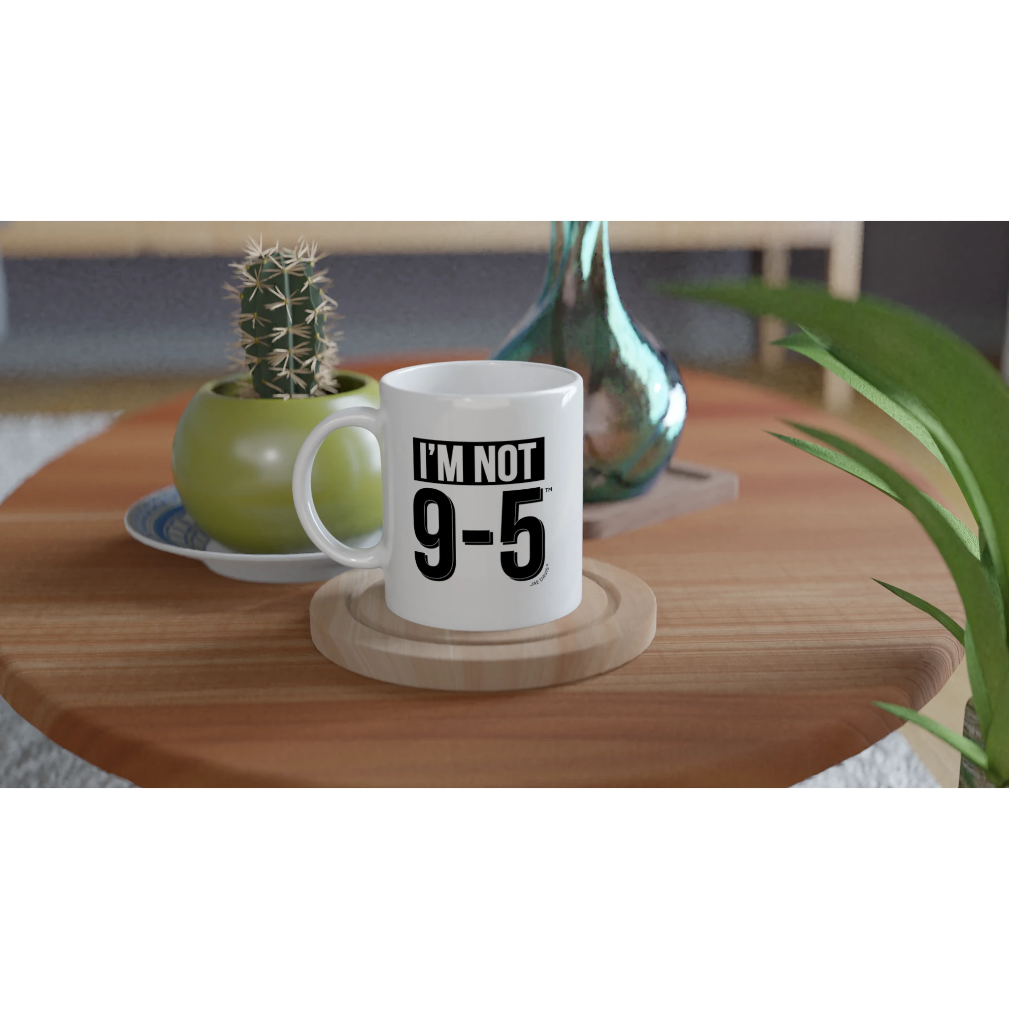 White mug with 'I'm not 9-5' text on a wooden table with plants